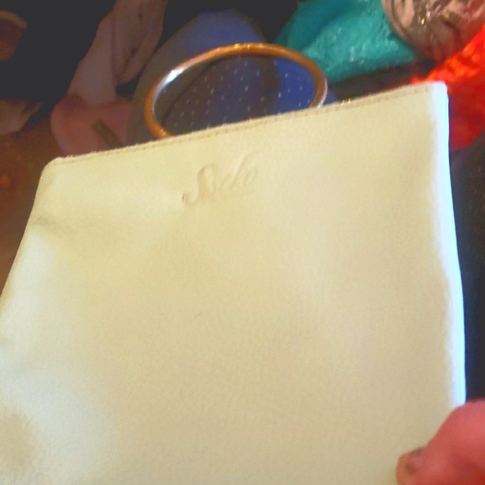 Sseko mint green clutch made in Uganda